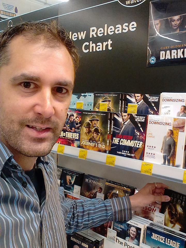 Nathan Head with a Jurassic Predator DVD in the New Release Chart at Asda in Northwich